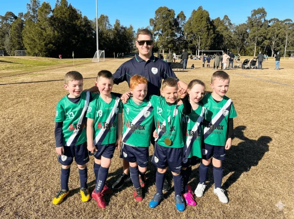 team photo if children in Tapex sponsored uniforms