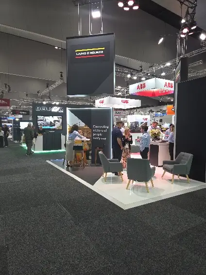 Exhibition stands and seating at the AusRAIL PLUS 2025 trade floor inside the Melbourne Convention and Exhibition Centre.